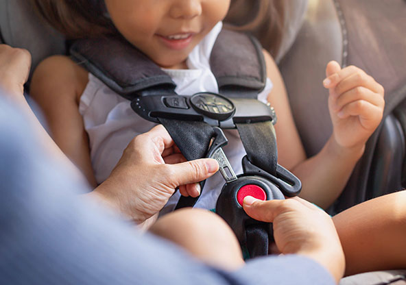 Little girl in car seat