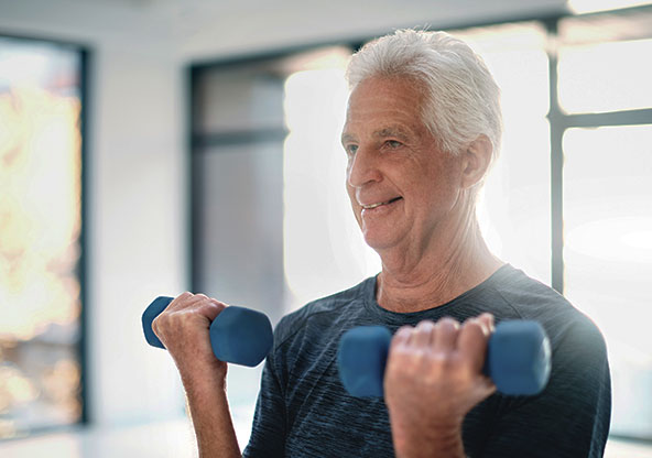 Old man lifting dumbbells