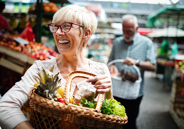 A senior Caucasian lady grocery shopping